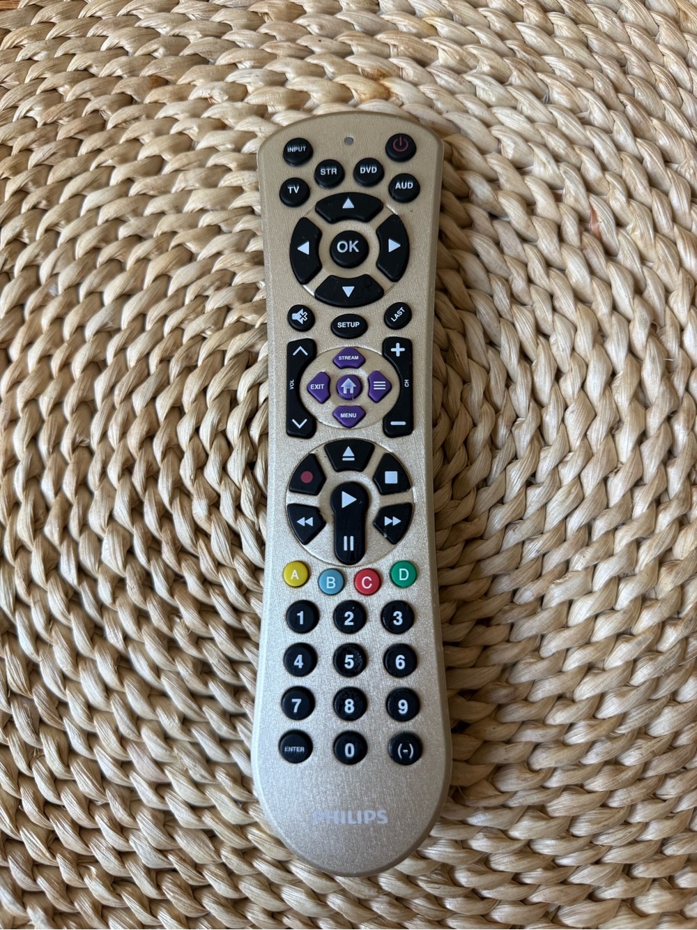 Philips beige and black multimedia remote with colored shortcut keys